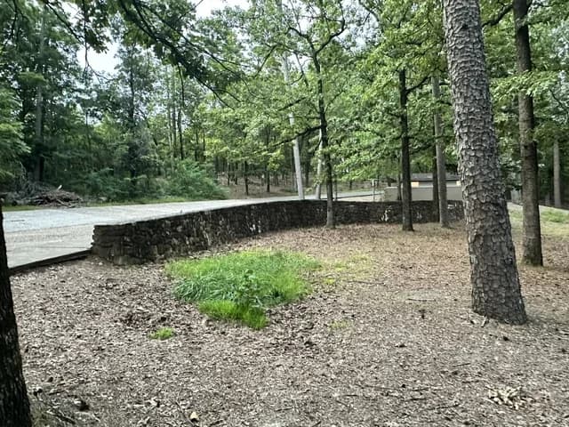 Old stone retaining wall beside Hot Springs Mountain Drive
