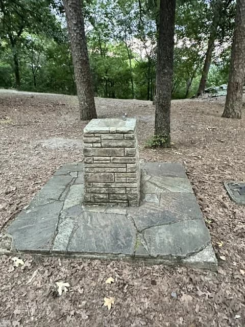 Old stone drinking fountain in the Hot Springs Mountain picnic area